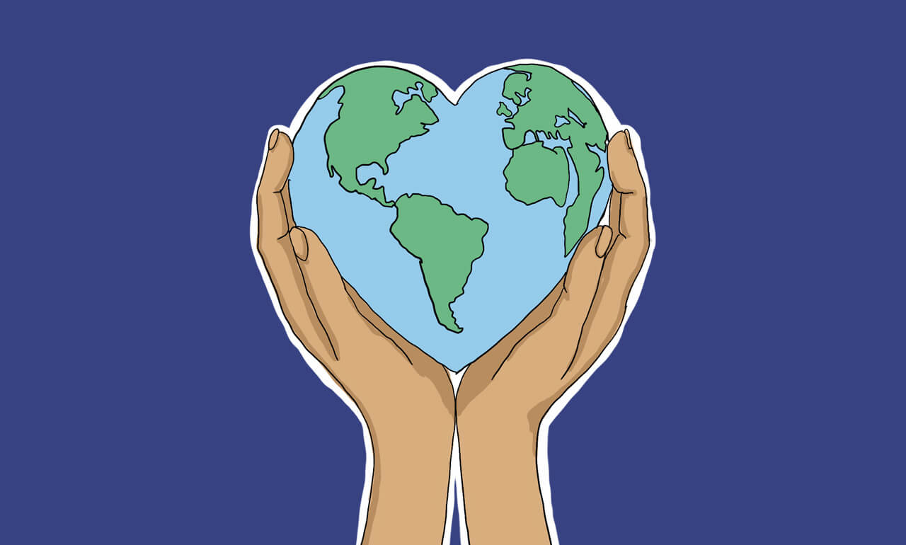 Deux mains tenant un globe terrestre en forme de cœur.
